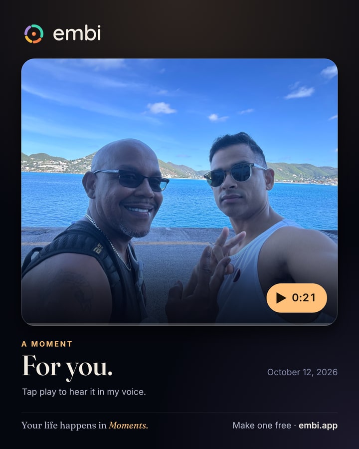 A sample Moment card: a photo of the Embi founders with a voice note.